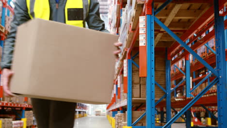 warehouse worker looking at package