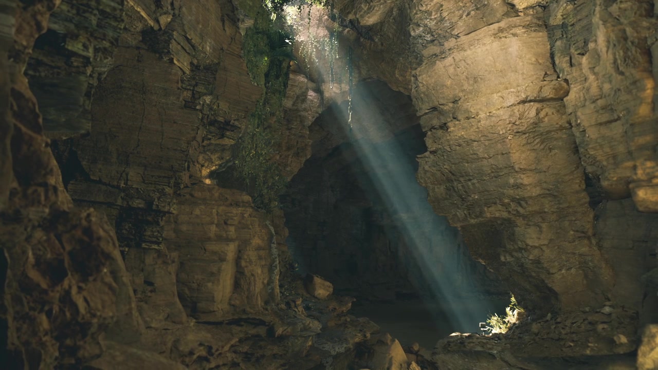 Mystical subterranean chamber with glowing rocks and airborne dust