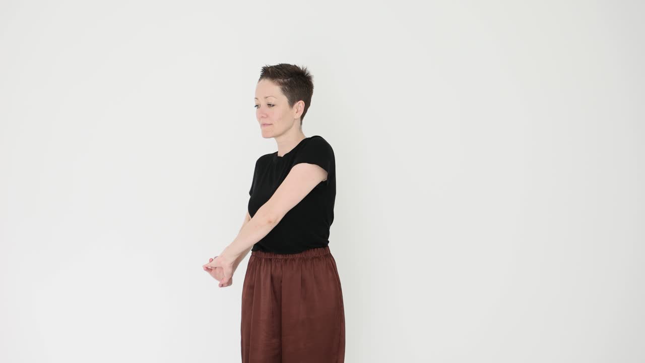 Woman with short hair posing indoors