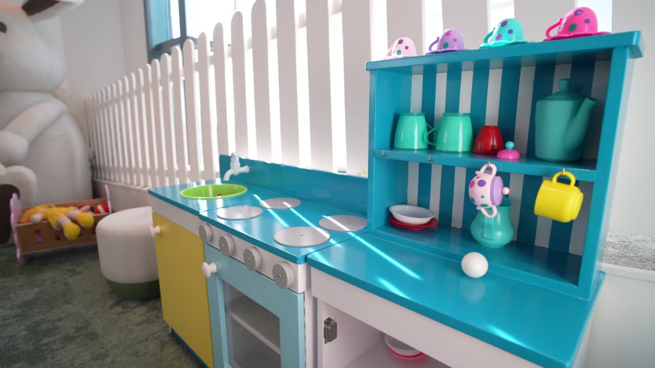 Bright and cheerful play kitchen in a daycare center, designed for imaginative play and learning