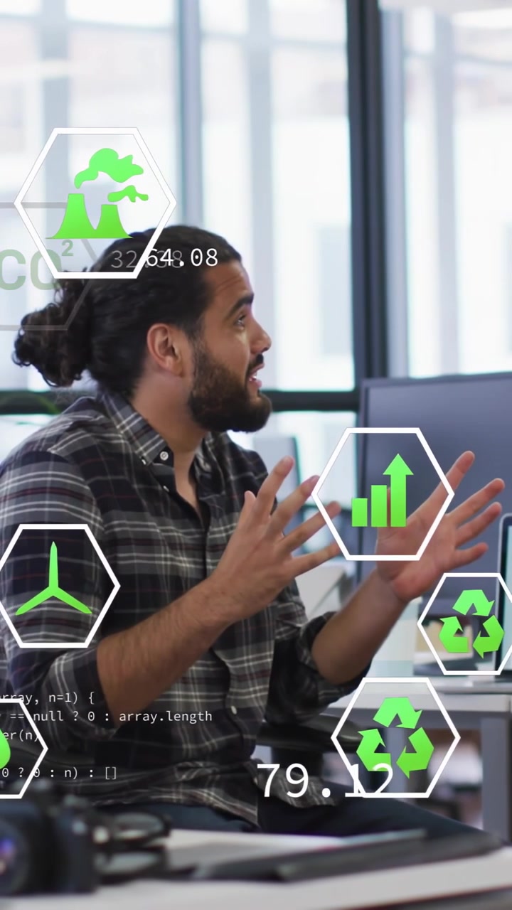 Presenting man in plaid shirt reviewing CO2 and growth as overlays appear at open office, laptop