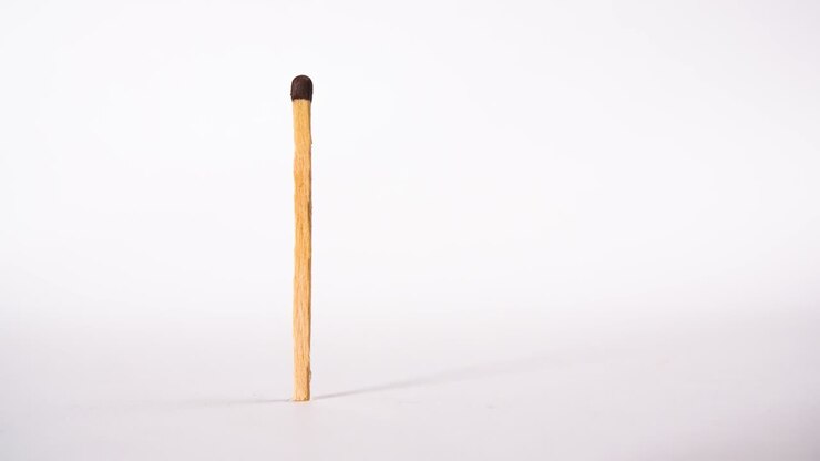 The match is burning. Macro shot, stop motion, concept of burnout or impotence