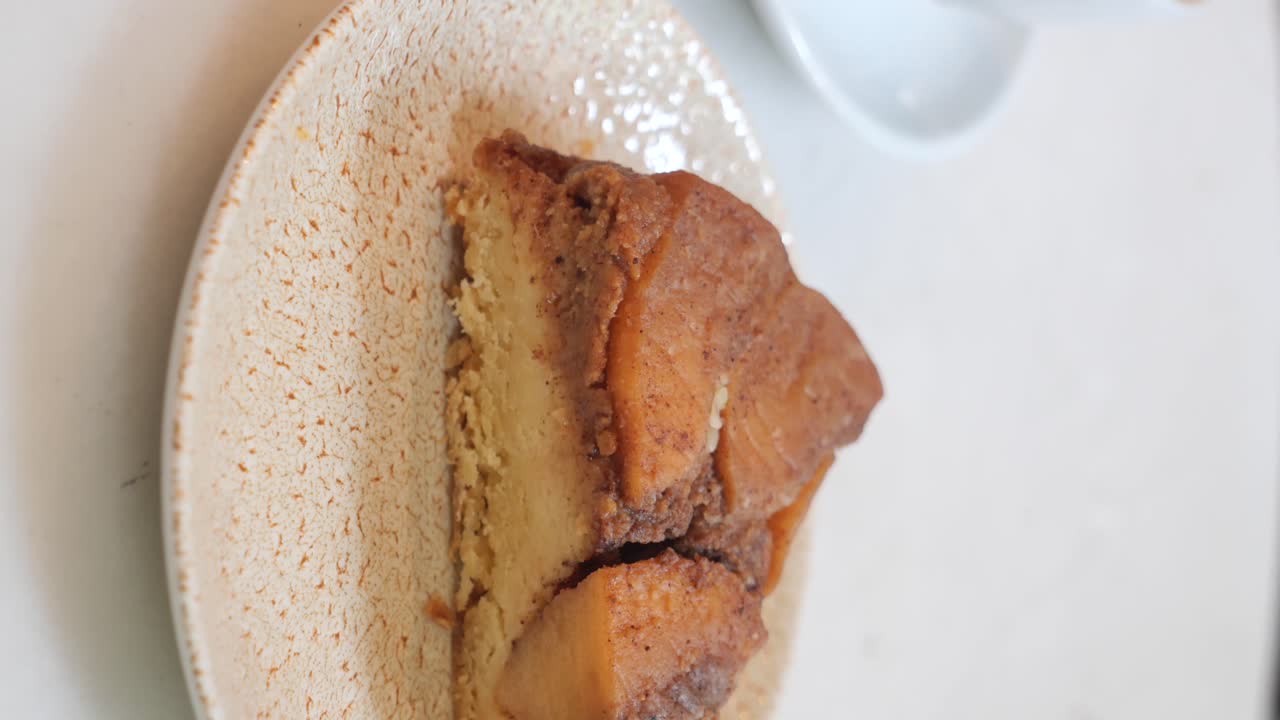 A close-up of a slice of cake on a patterned plate