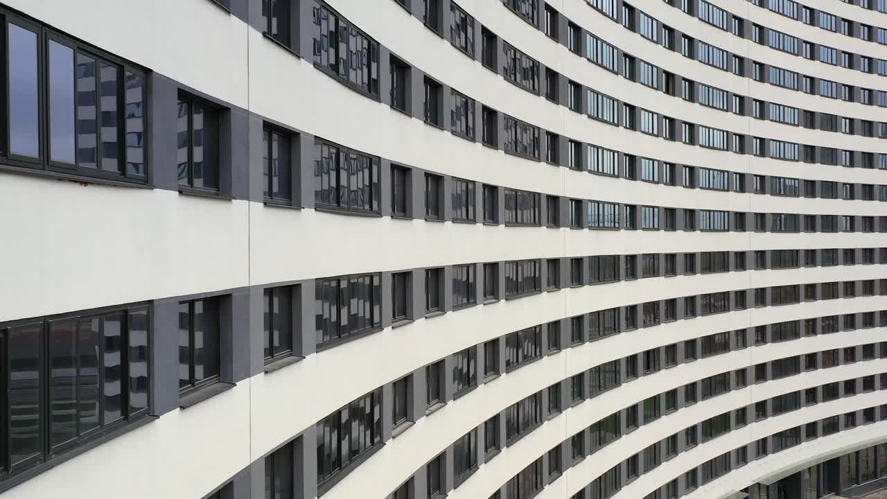 Curved Modern Building Facade with Repeating Windows