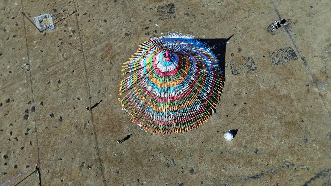 Qilian Grassland, Xining, Qinghai Province, China - A Top-down View of a Colorful Circular Structure Standing Alone on a Vast Grassland - Orbit Drone Shot