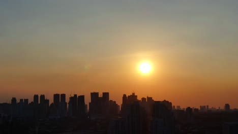 serene shot of the manila skyline during sunset showing the hazy cityscape