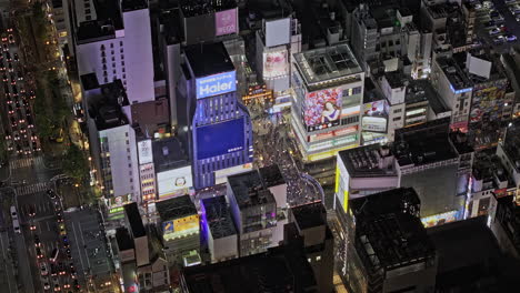 osaka japan aerial v108 zoomed birds eye view fly around dotonbori capturing ebisubashi bridge over the canal, crowded streets and downtown night cityscape - shot with mavic 3 pro cine - oct 9th 2023