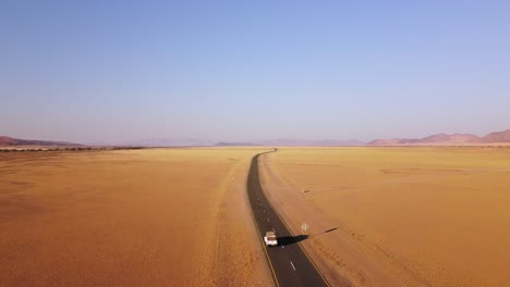 Namibian-self-drive-wildlife-adventure-with-a-rooftop-tent-equipped-Toyota-Hilux-in-Sossusvlei's-iconic-sand-dunes-at-sunset