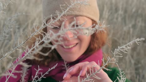woman smiles in a winter field