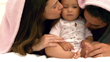 parents with baby relaxing