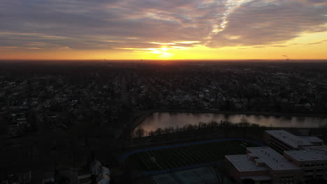 A-drone-view-of-a-Long-Island-neighborhood-at-sunrise-with-cloudy-skies