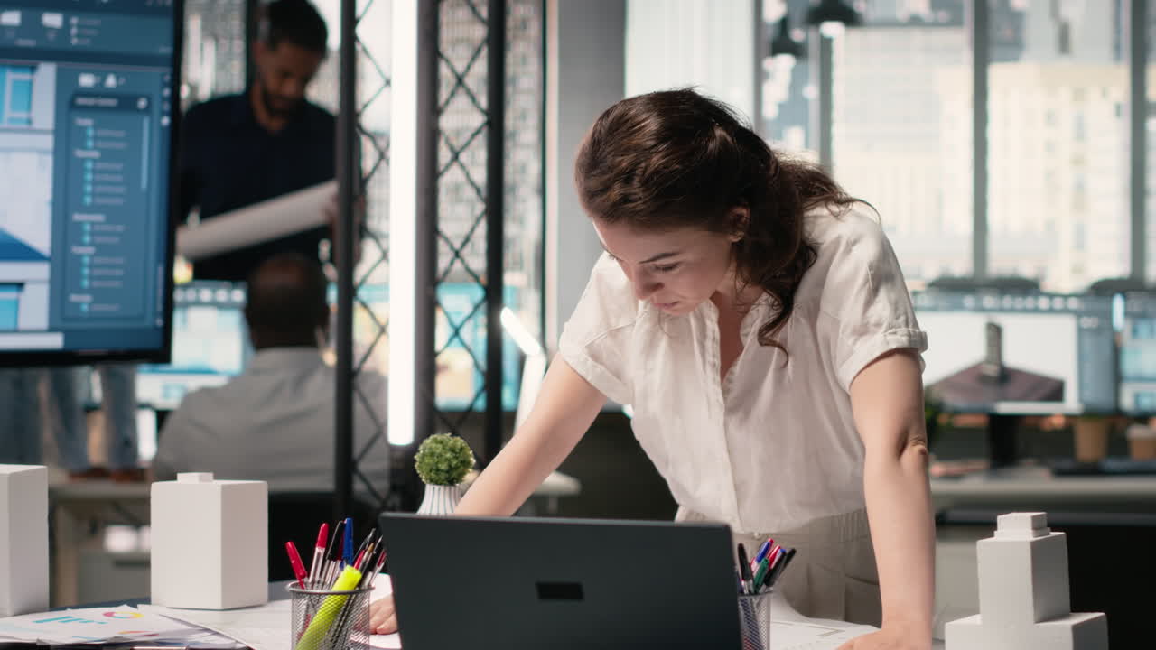 Vertical Video Property developer finalizing plans for land acquisition in modern office space