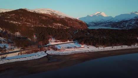 vanlifers and campers staying at north norvegian fjord beach