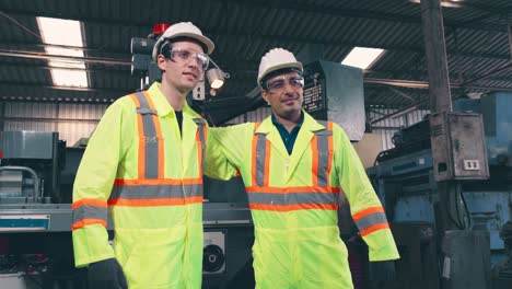 factory workers handshake with team member in the factory