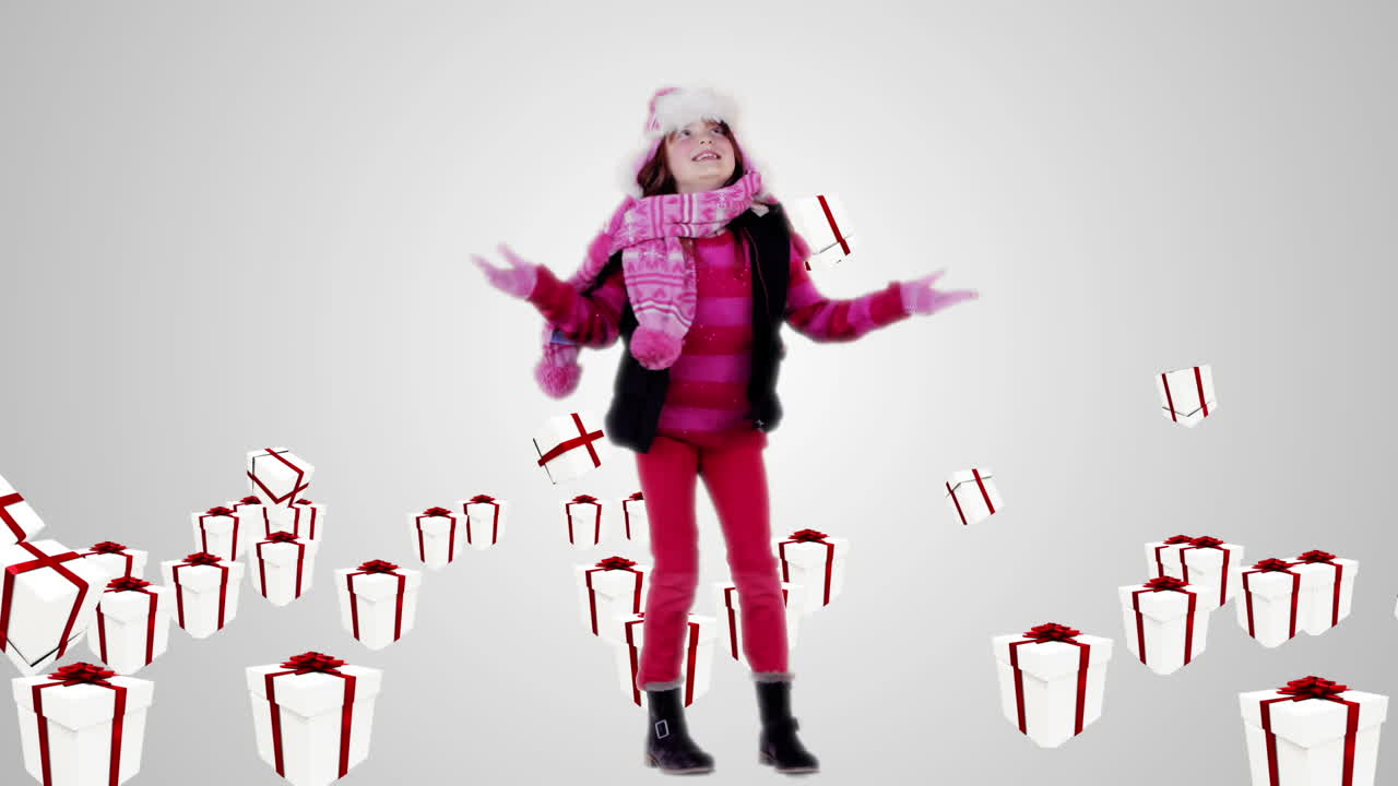 niña festiva bajo regalos de navidad que caen