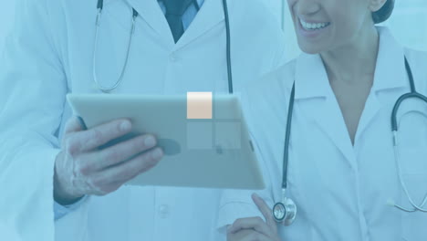 reviewing tablet with medical data animation, doctors analyzing information together