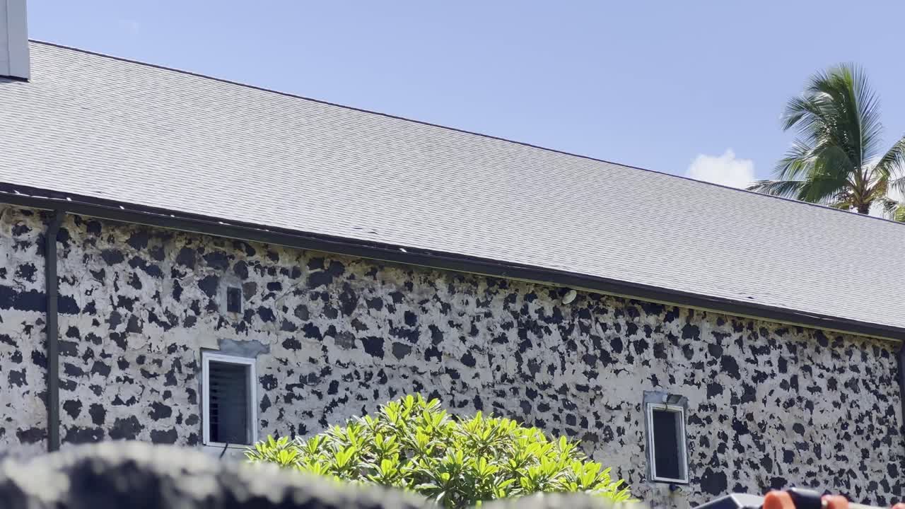 Cinematic close-up panning shot of the historic Moku&lsquo;aikaua Church in Kailua-Kona on the island of Hawai'i