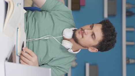 Vertical-video-of-Poor-male-student-unhappy-and-sad.