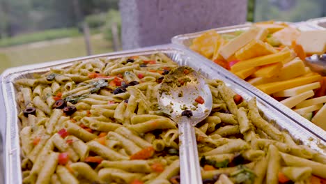 silver trays full of food