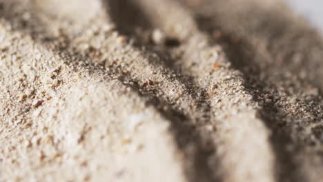 video of close up of sand grains and copy space background