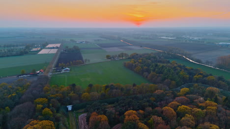 stunning sunset in dutch fields. stunning aerial view of the netherlands showcasing vibrant fields and a peaceful sunset over the landscape