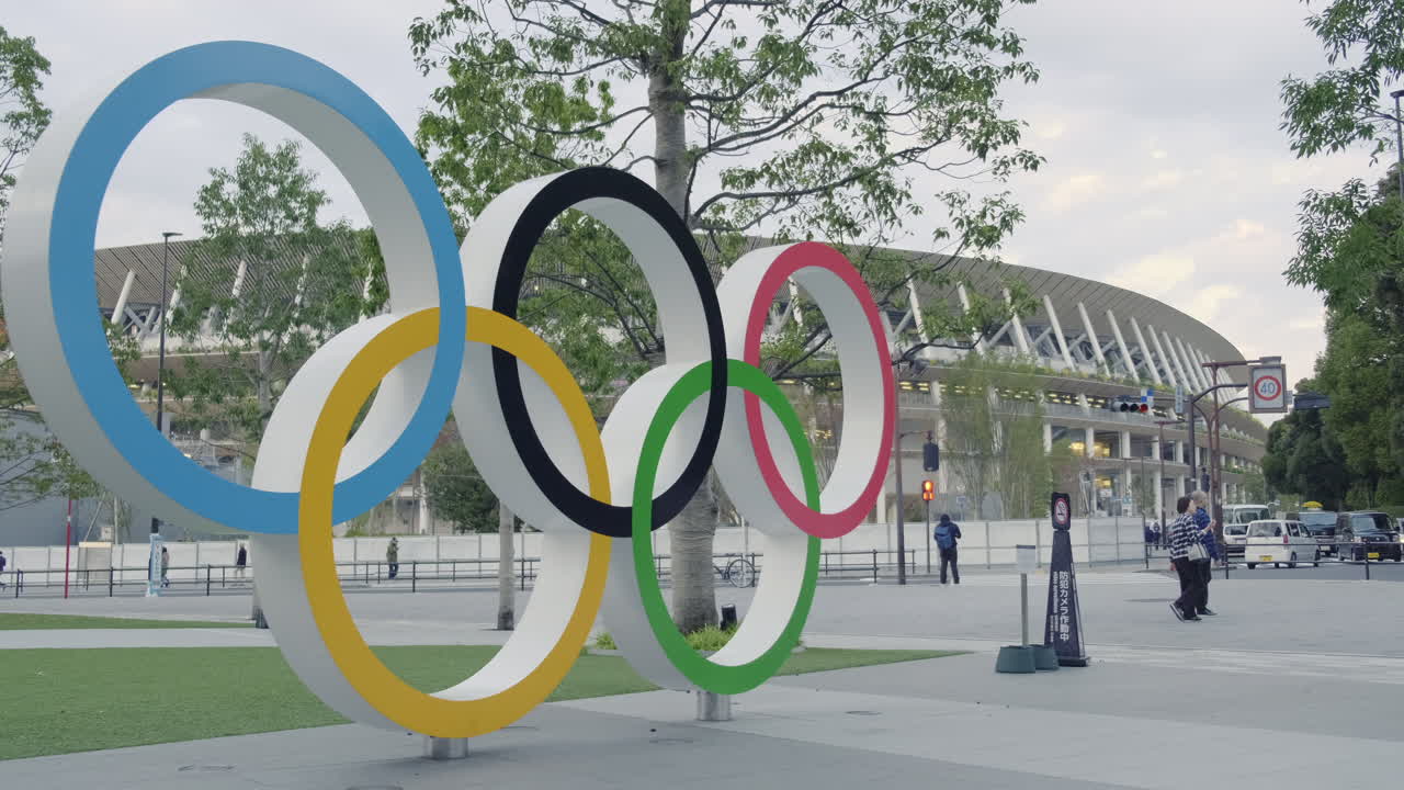 The Summer Olympics this year will be head in Tokyo. Olympics logo set against the National Stadium where the opening ceremony and games is being held.