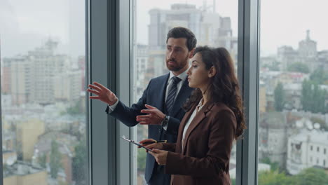 Boss-telling-girl-secretary-work-issue-at-office-close-up.-Woman-making-notes.