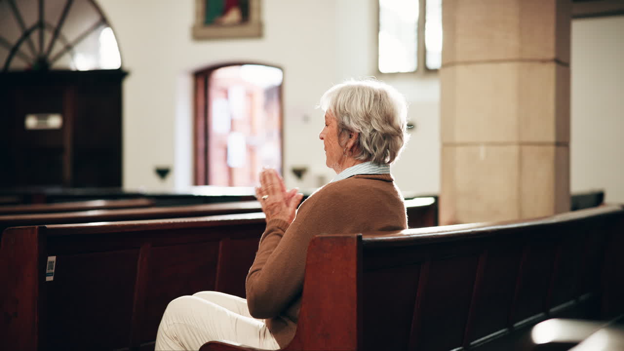 Senior woman praying in church