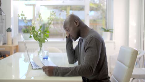 tracking past worried man reviewing bills