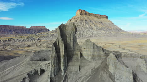 factory butte, north caineville mesa and grey sandstone formation in utah desert drone aerial view