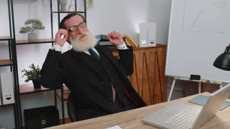 tired businessman sleeping at his desk