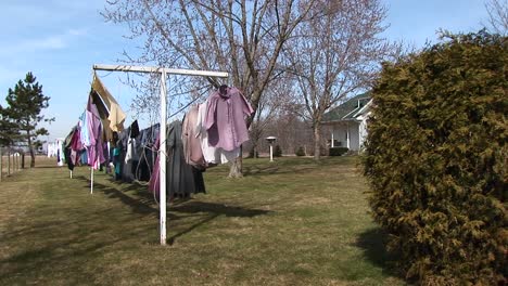 clothes are hung on an outdoor clothesline to dry in the sunshine