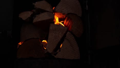 pile of wood logs burning for hot tub - close up