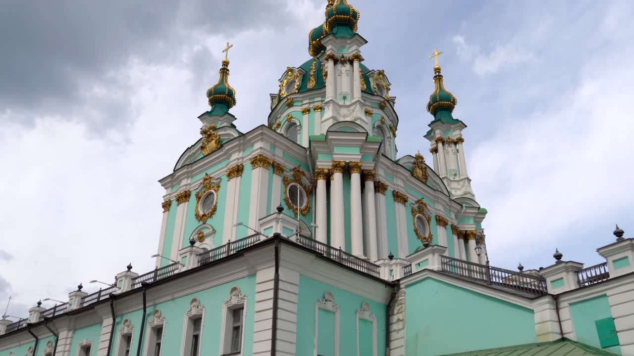 Ukraine, Kyiv's famous St.Andrew Church's, Footage starts from the flea market set up on the hill that goes to the church and shows the church from bottom upon a summer day with cloudy skies.