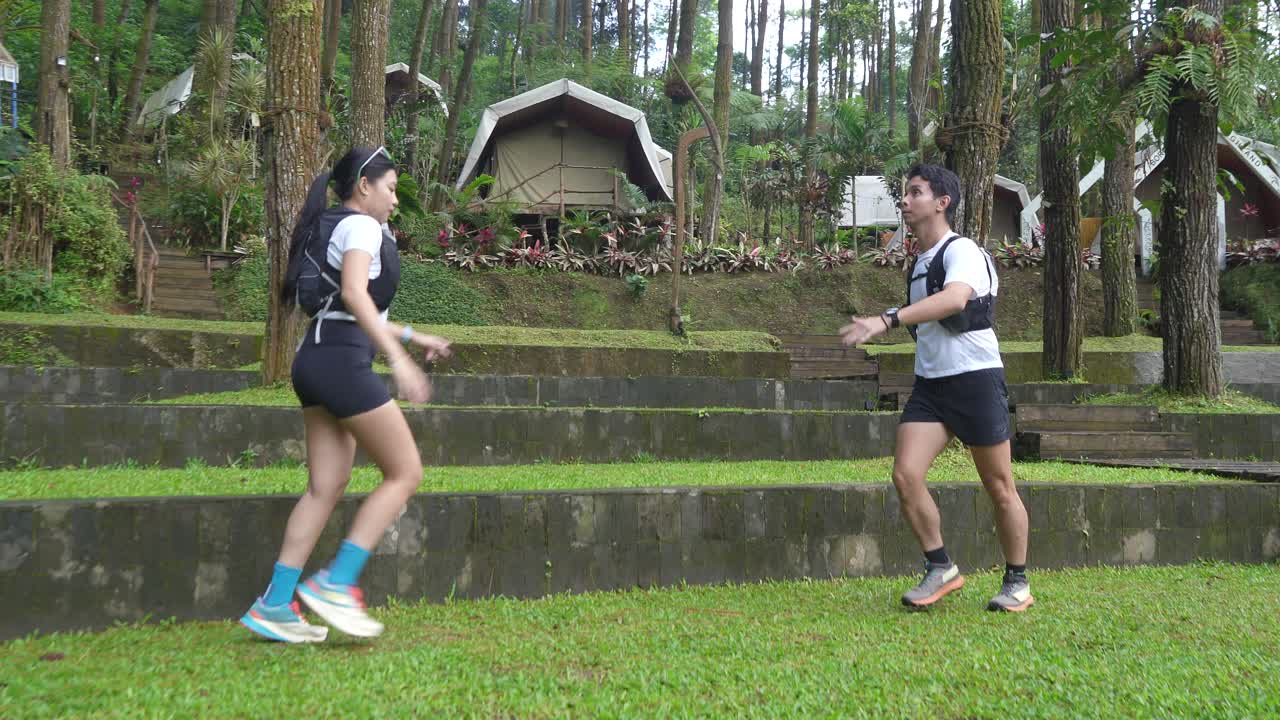 Couple Running in a Forest
