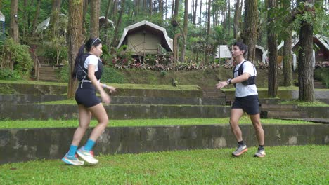 couple running in a forest