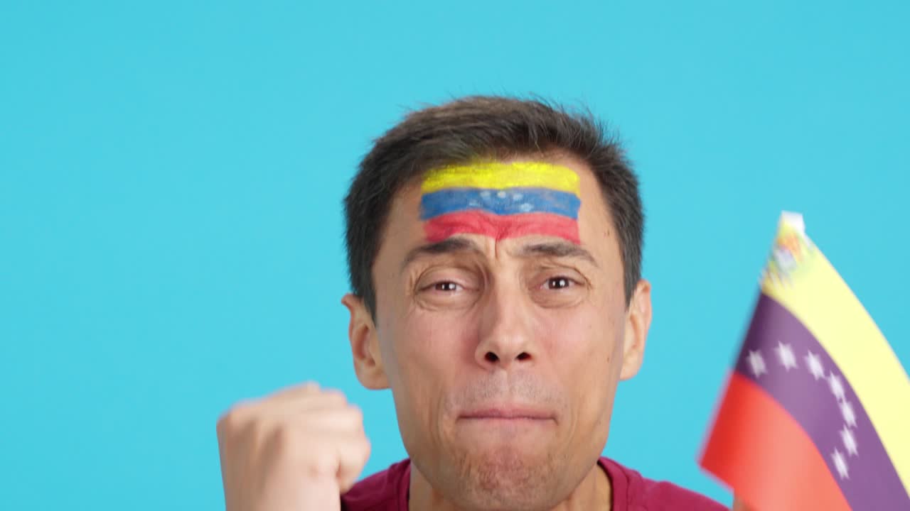 Very nervous man supporting venezuelan team during a difficult match