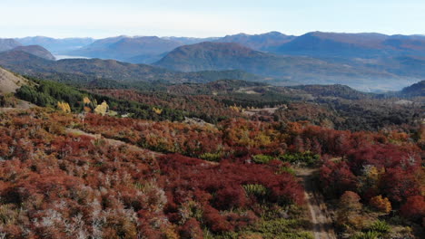 Aerial-flyover-colorful-landscape-with-gigantic-mountain-range-in-background