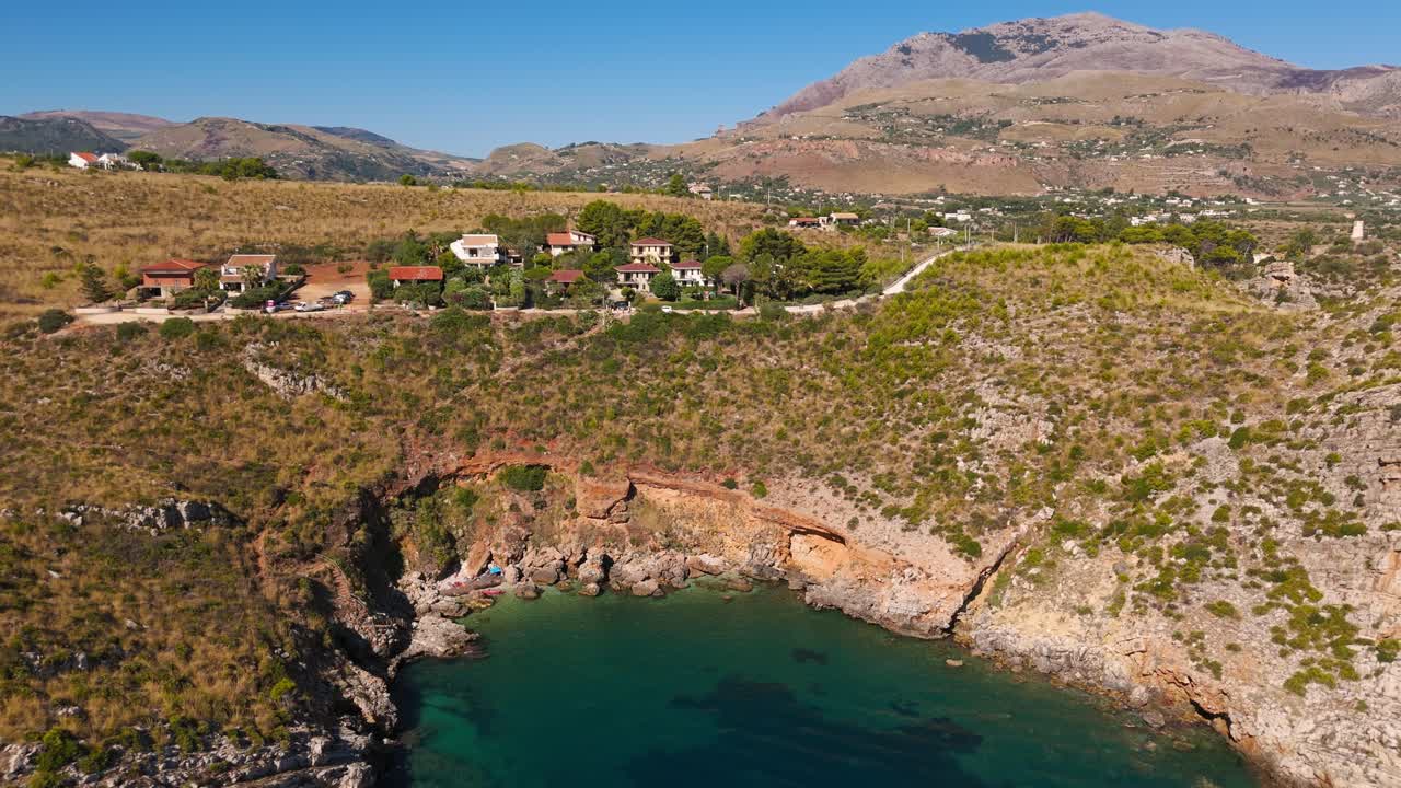 Stunning aerial view of Cala Rossa, Sicily, Italy with clear blue waters