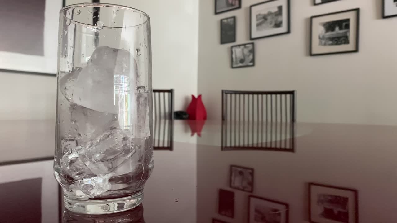 Large ice blocks cascading down, glass beaker, apartment decoration