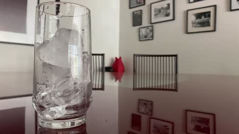 large ice blocks cascading down, glass beaker, apartment decoration