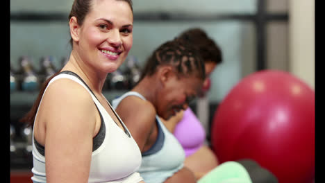 Pregnant-women-doing-yoga-in-fitness-studio