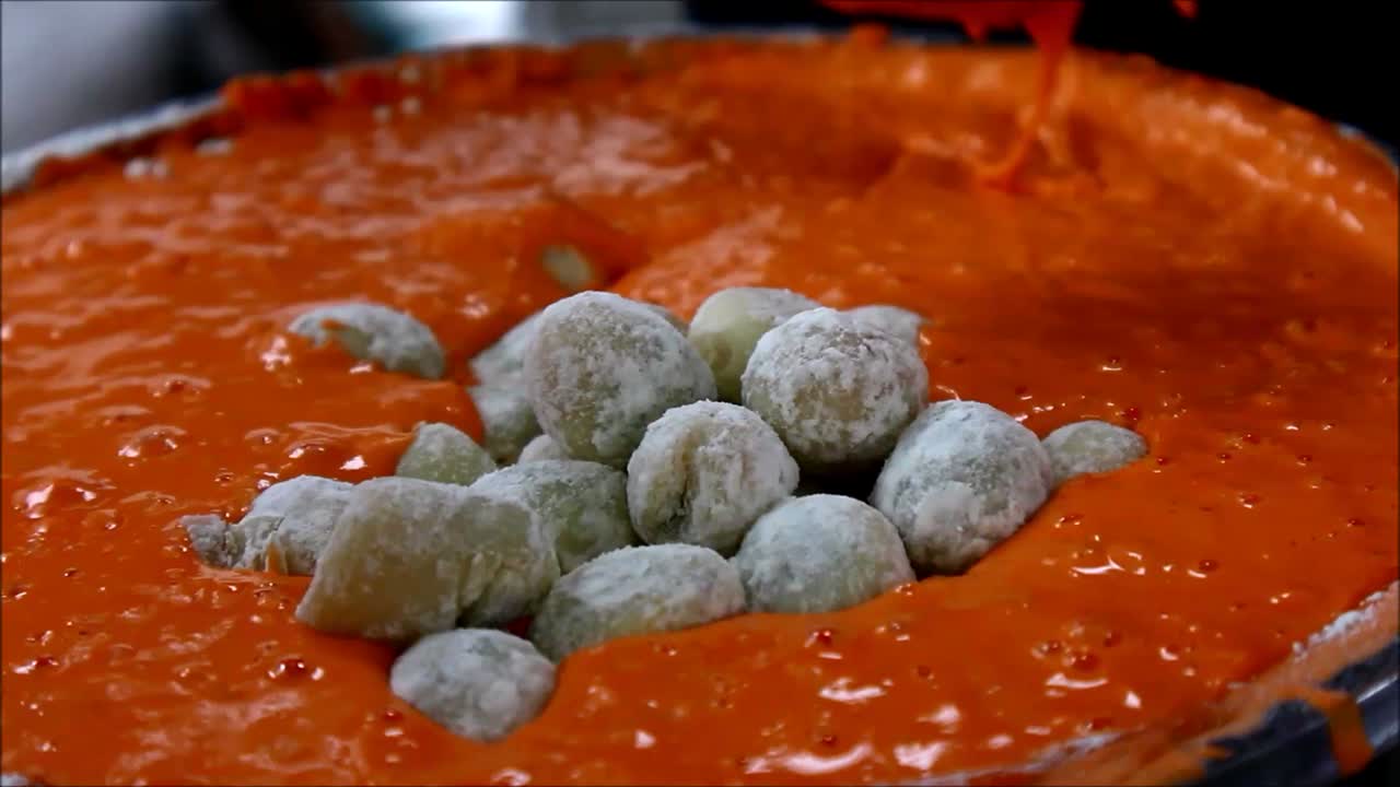 Close up video shot quail eggs in a flour batter ready for deep frying