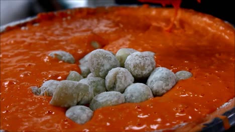 close up video shot quail eggs in a flour batter ready for deep frying