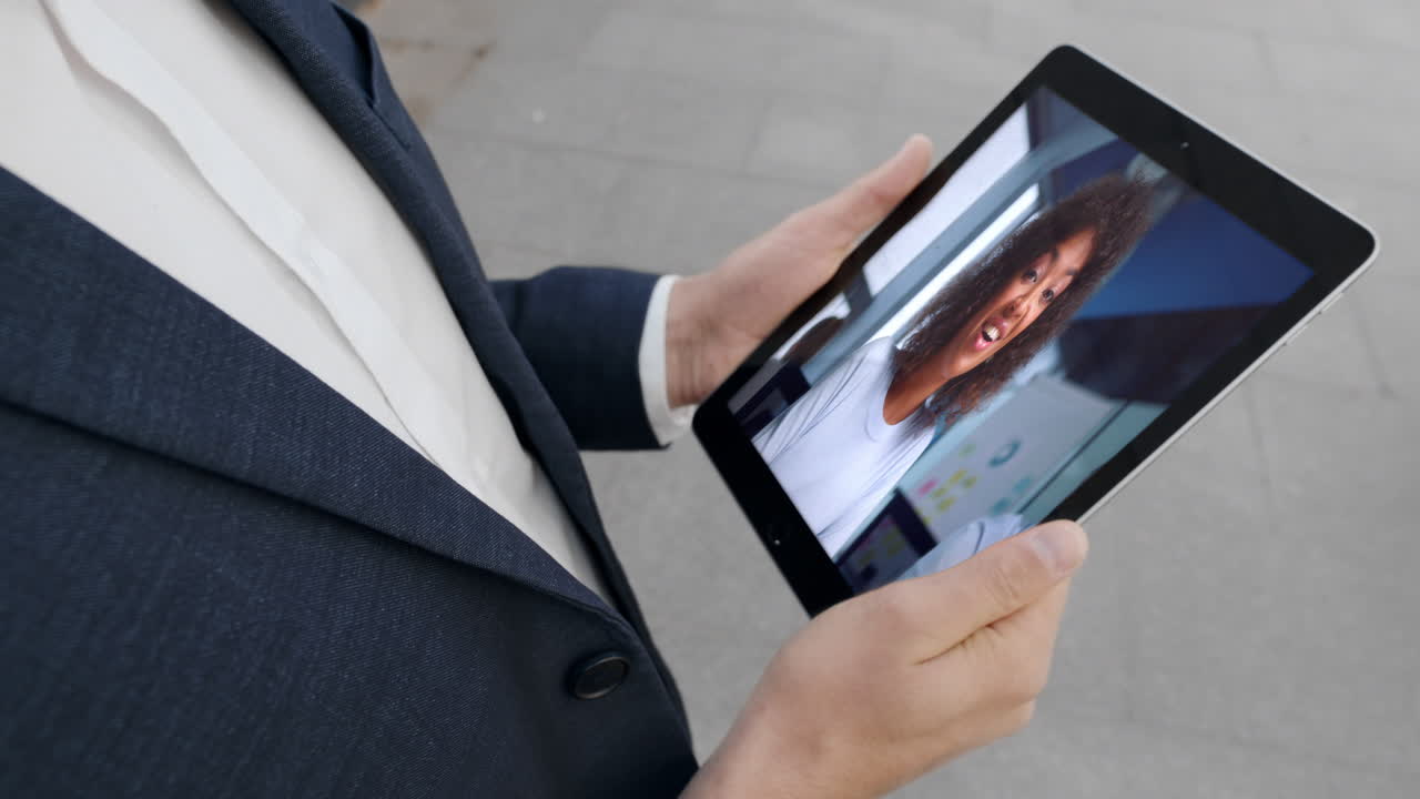 Entrepreneur listening coach video conference at tablet closeup. Virtual meeting