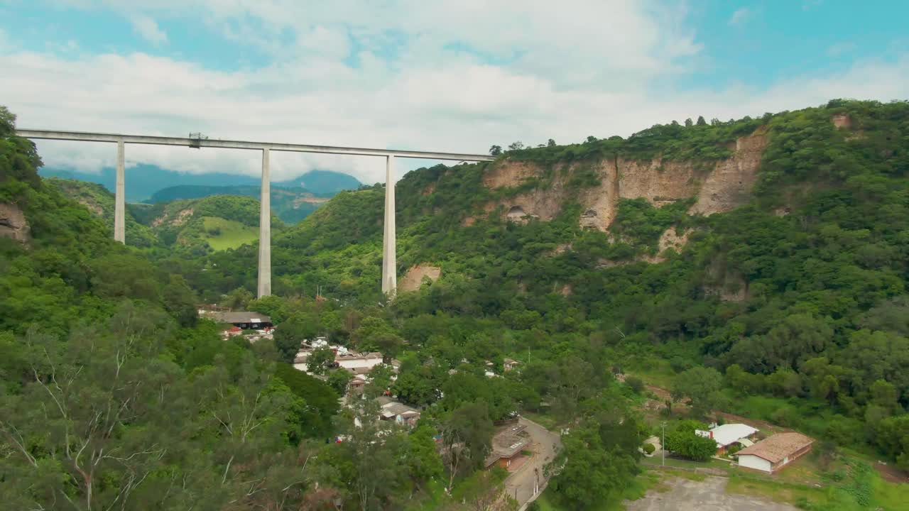 Drone shot of a bridge structure over town of Atenquique, Jalisco