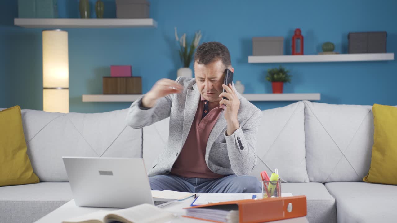 Home office worker man speaks on the phone in managerial qualifications.