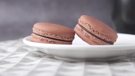 chocolate macarons on a plate