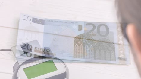 Animation-of-euro-banknotes-falling-over-payment-terminal