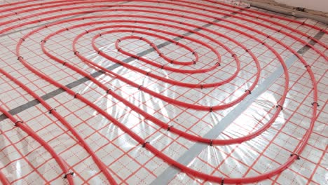 installing underfloor heating pipes for water heating. heating systems. pipes for a heat-insulated floor.